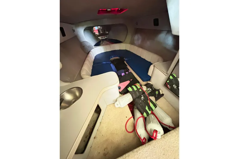 Slide: The Image of Interior of 1987 Chris-Craft 312 Stinger boat with seating and life jackets. - 32