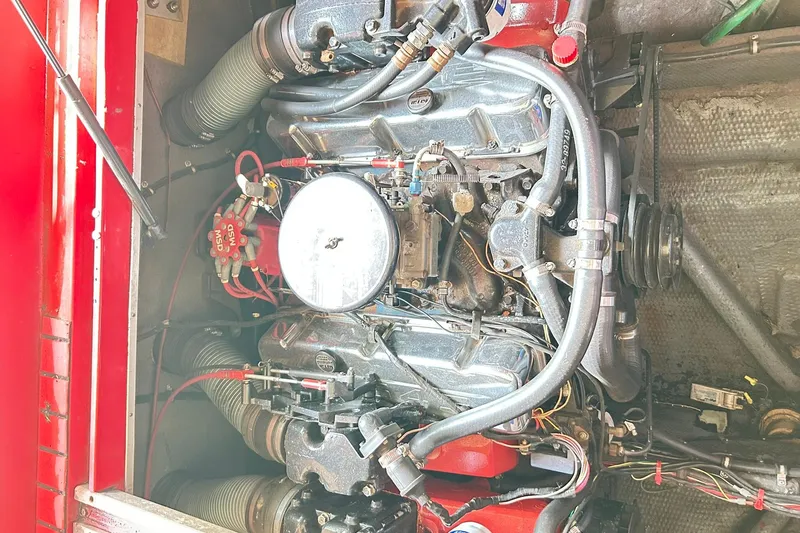 Slide: The Image of Engine of a 1987 Chris-Craft 312 Stinger boat, showcasing detailed components. - 38