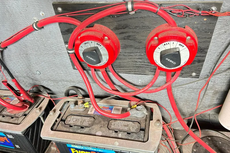 Slide: The Image of Battery switches and wiring in a 1987 Chris-Craft 312 Stinger boat. - 40