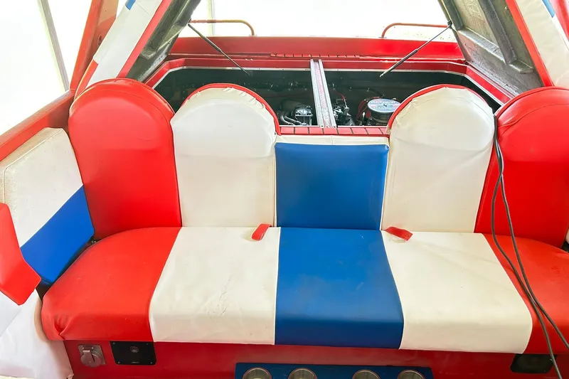 Slide: The Image of 1987 Chris-Craft 312 Stinger interior with red, white, and blue seating. - 47