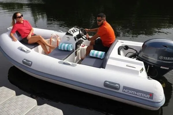Slide: The Image of 2026 Northstar Axis 5.3 boat with Yamaha 115HP engine on calm water. - 4