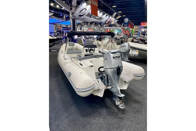 Slide: The Image of 2026 Northstar Axis 5.3 boat with Yamaha 115HP engine displayed at a boat show. - 8