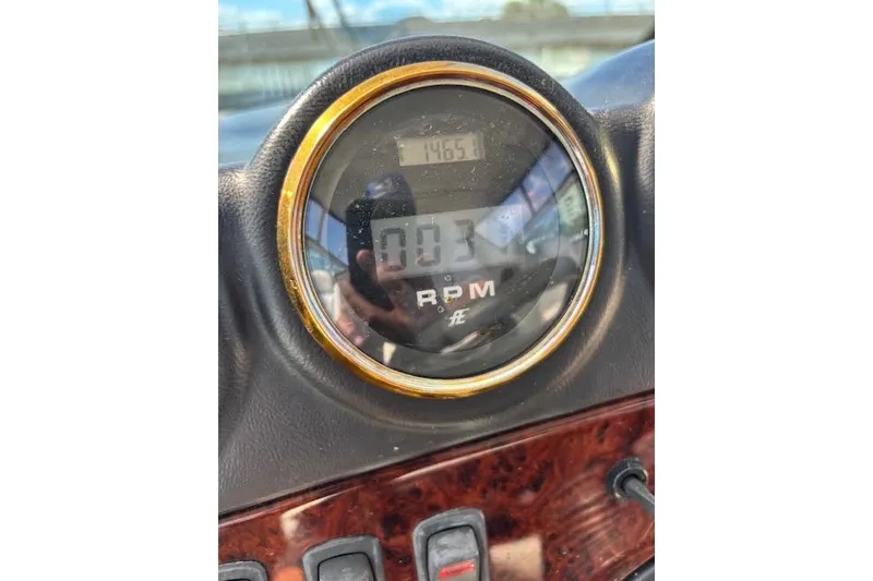 Slide: The Image of 2004 Carver 466 Motor Yacht helm with dual seats and navigation instruments. - 21