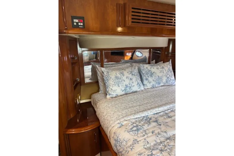 Slide: The Image of Luxurious bathroom in 2004 Carver 466 Motor Yacht with granite countertop and oval window. - 54