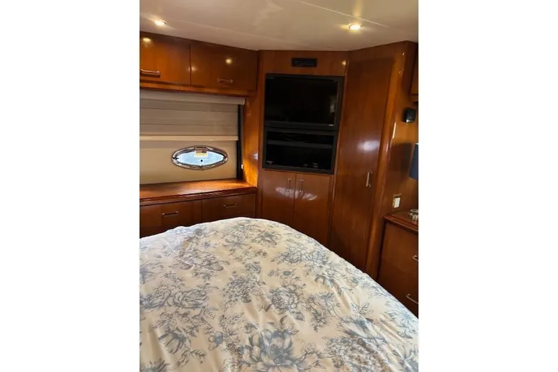 Slide: The Image of Luxurious bedroom interior of 2004 Carver 466 Motor Yacht with floral bedding. - 56