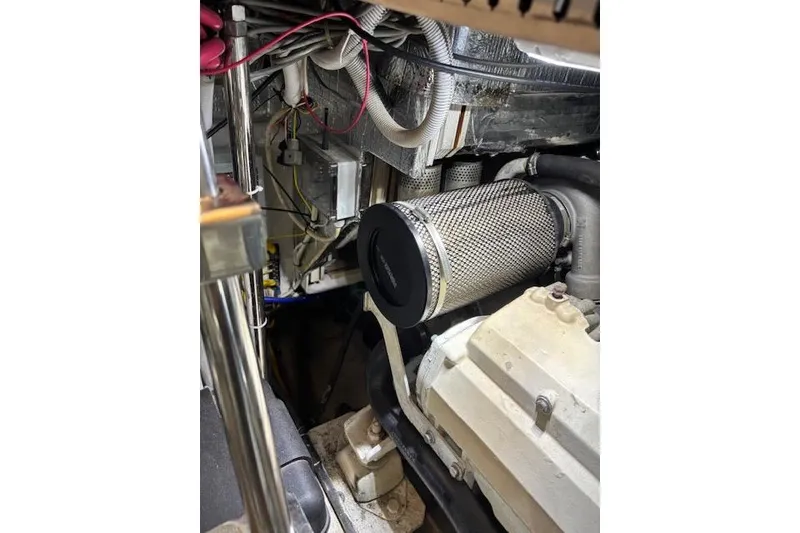 Slide: The Image of Engine compartment of 2004 Carver 466 Motor Yacht with wooden flooring. - 79