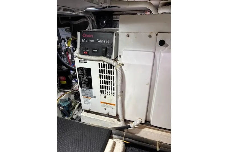 Slide: The Image of Engine compartment of 2004 Carver 466 Motor Yacht with warning labels. - 86