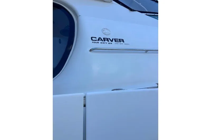 Slide: The Image of 2004 Carver 466 Motor Yacht docked, rear view with clear skies. - 10
