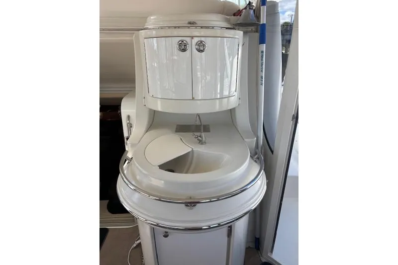 Slide: The Image of Side view of a 2004 Carver 466 Motor Yacht docked at a marina. - 13