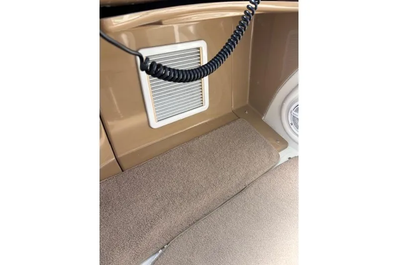 Slide: The Image of Control panel of 2004 Carver 466 Motor Yacht with navigation screen and joystick controls. - 25