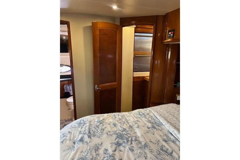 Slide: The Image of Interior of 2004 Carver 466 Motor Yacht with wooden cabinets and window. - 50