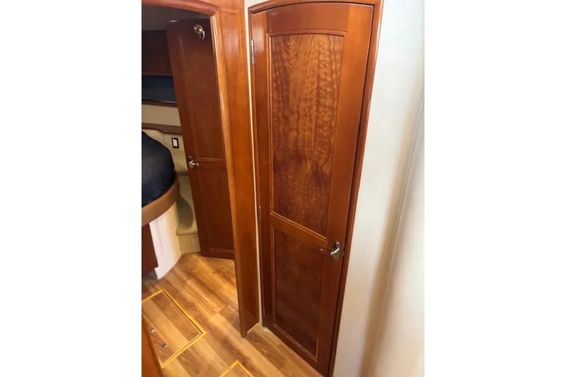 Slide: The Image of Storage compartment in 2004 Carver 466 Motor Yacht with cleaning supplies and equipment. - 69