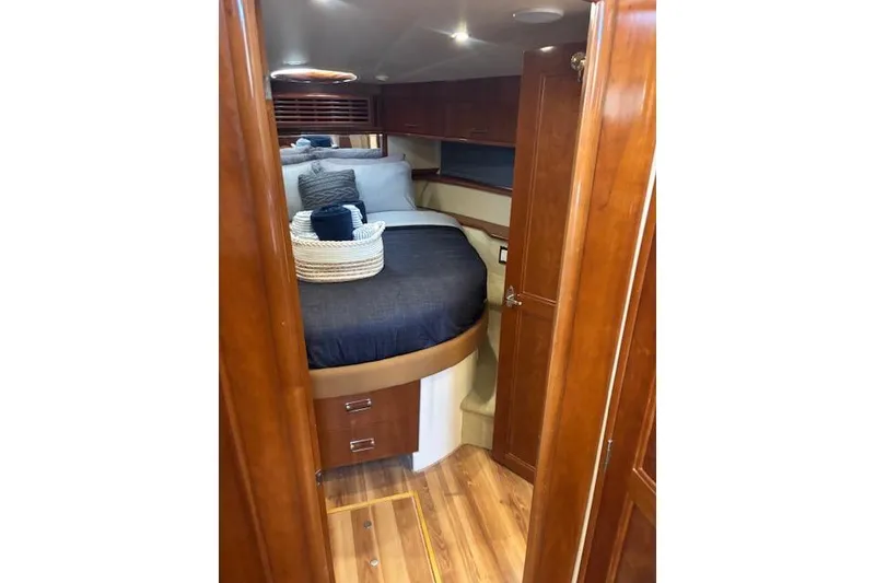 Slide: The Image of Interior of 2004 Carver 466 Motor Yacht with wooden doors and flooring. - 70