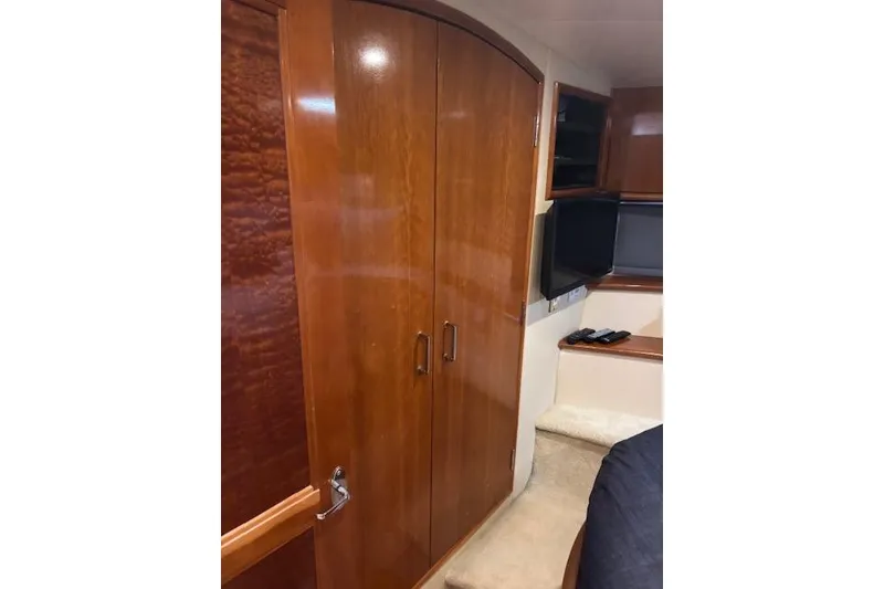 Slide: The Image of Luxurious bathroom in 2004 Carver 466 Motor Yacht with granite countertop and stainless steel sink. - 73