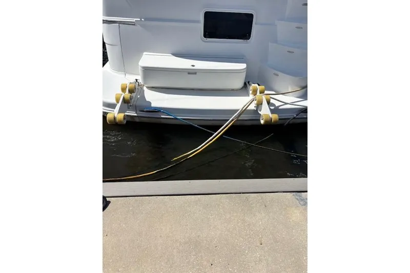 Slide: The Image of 2004 Carver 466 Motor Yacht docked, named "S.S. Enterprise II," with visible rear view. - 8