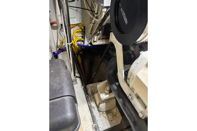 Slide: The Image of Engine compartment of 2004 Carver 466 Motor Yacht with visible components and wiring. - 82