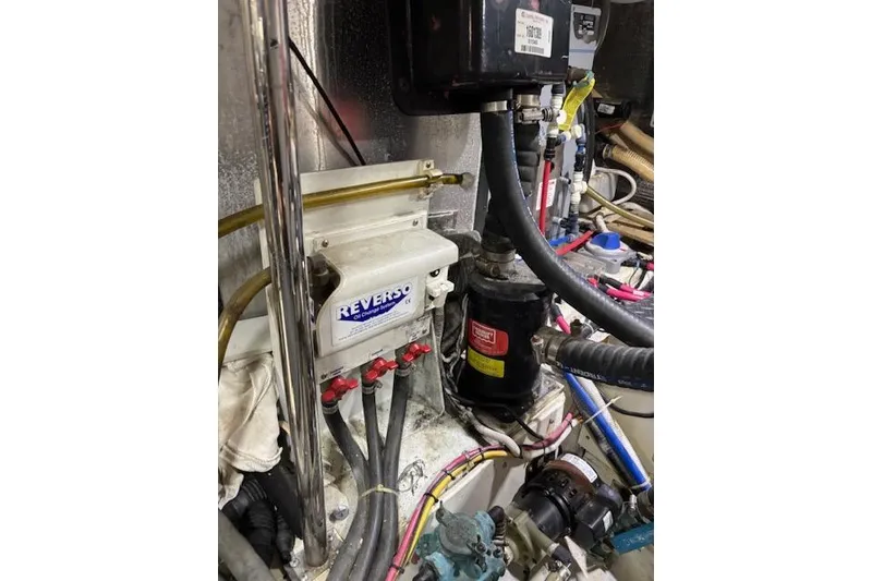 Slide: The Image of Engine room of 2004 Carver 466 Motor Yacht with various mechanical components. - 91