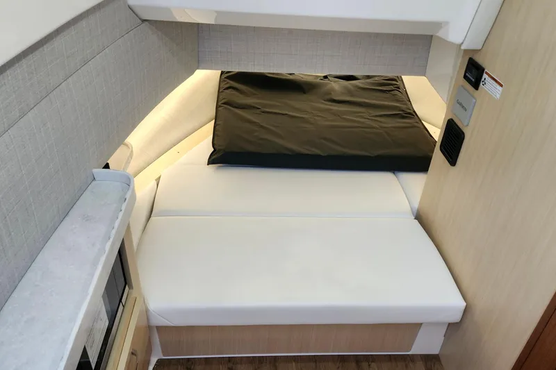 Slide: The Image of 2026 Regal 38 SAV interior cabin with modern bedding and sleek design. - 19