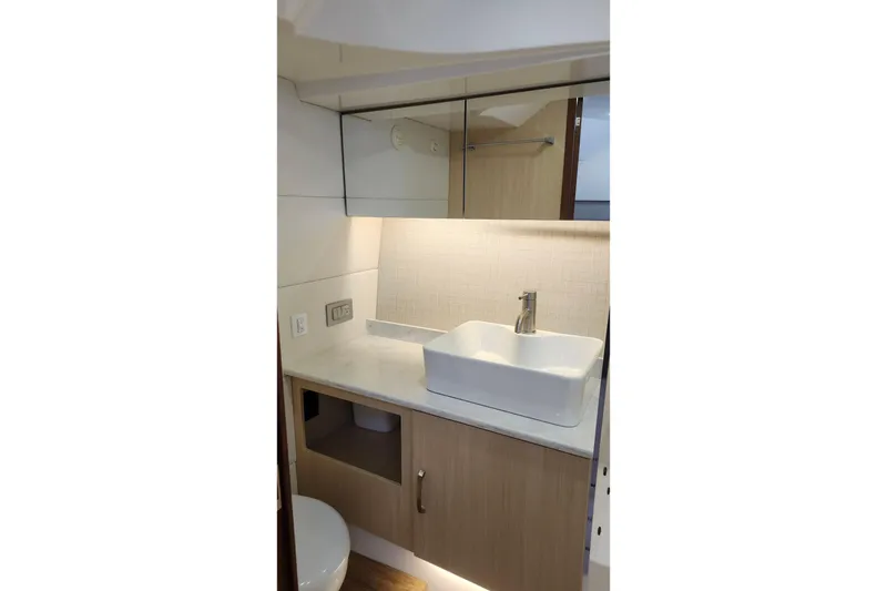 Slide: The Image of Modern bathroom interior in 2026 Regal 38 SAV yacht, featuring sleek sink and cabinetry. - 21
