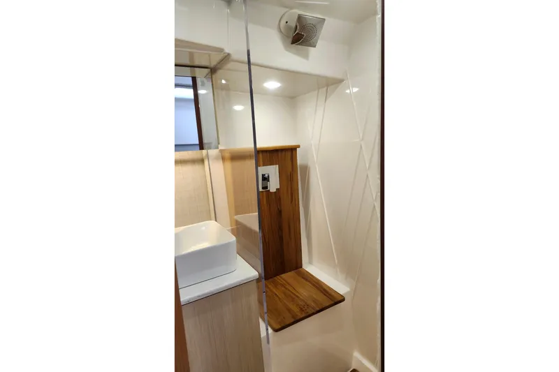 Slide: The Image of Modern bathroom interior of 2026 Regal 38 SAV yacht with wood accents and sleek design. - 22