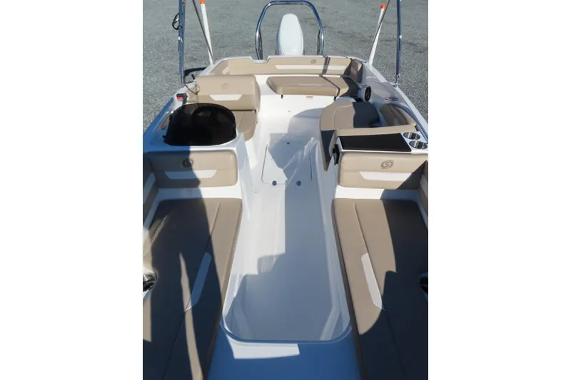 Slide: The Image of 2021 Hurricane SunDeck Sport 185 OB interior with beige seating and spacious layout. - 12