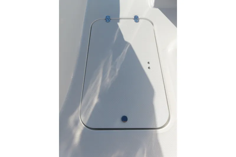 Slide: The Image of 2021 Hurricane SunDeck Sport 185 OB boat deck hatch with shadow. - 13