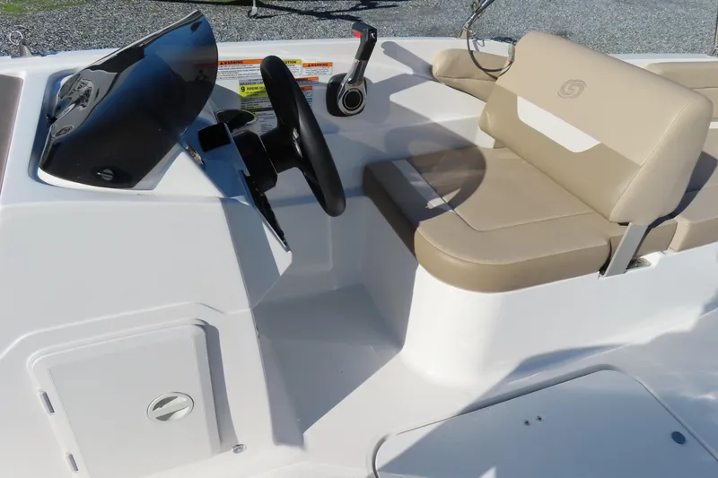Slide: The Image of 2021 Hurricane SunDeck Sport 185 OB boat interior with beige seating and steering console. - 15