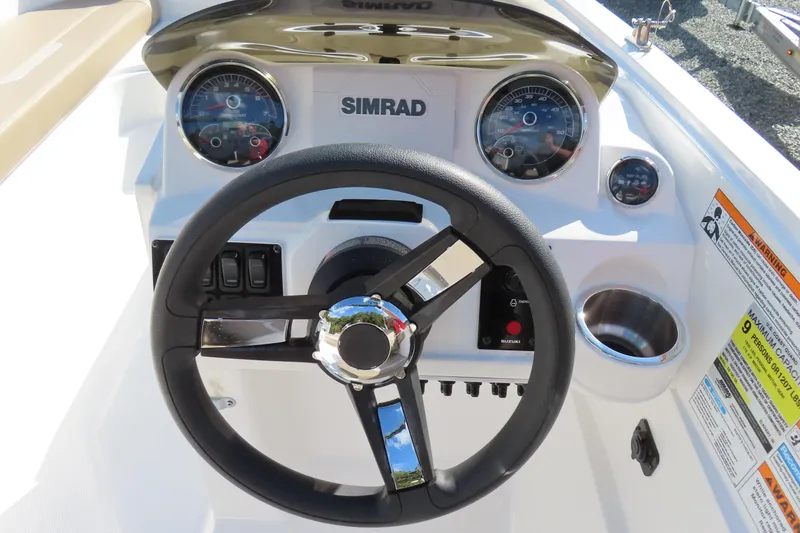 Slide: The Image of 2021 Hurricane SunDeck Sport 185 OB dashboard with steering wheel and gauges. - 17