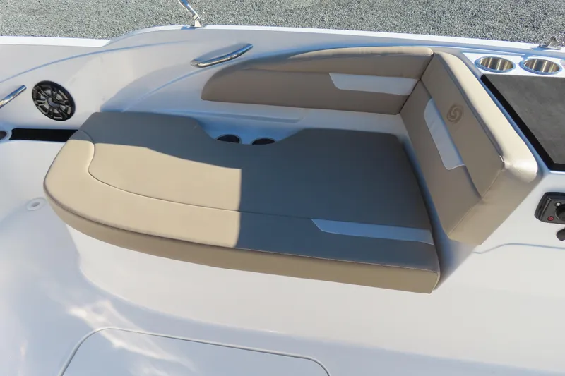 Slide: The Image of 2021 Hurricane SunDeck Sport 185 OB boat seating area with cup holders and speaker. - 21