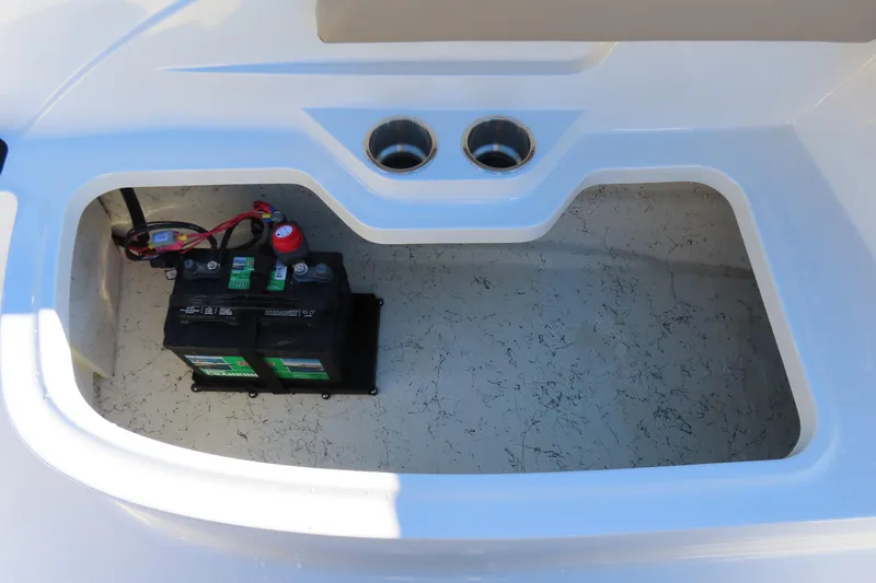 Slide: The Image of Battery compartment of 2021 Hurricane SunDeck Sport 185 OB boat, featuring dual cup holders. - 22