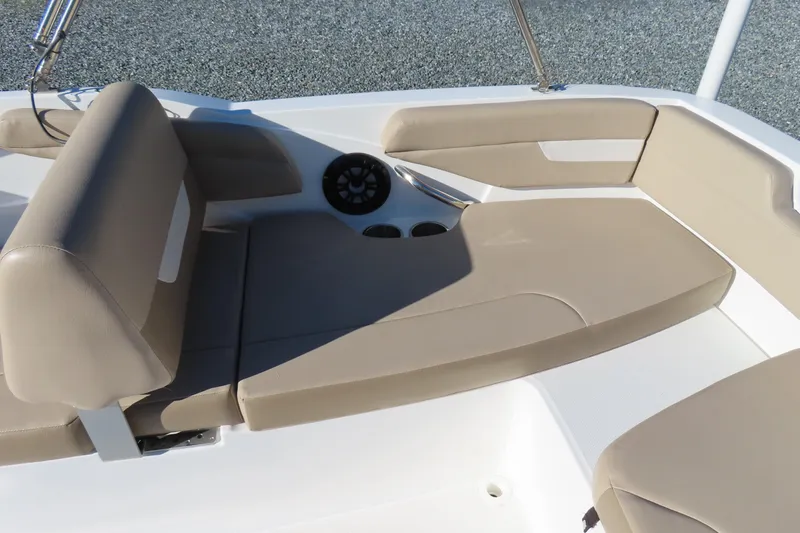 Slide: The Image of 2021 Hurricane SunDeck Sport 185 OB boat interior with beige seating and cup holders. - 25
