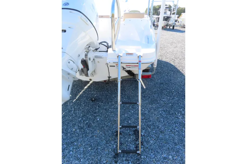 Slide: The Image of 2021 Hurricane SunDeck Sport 185 OB boat with extended swim ladder. - 6
