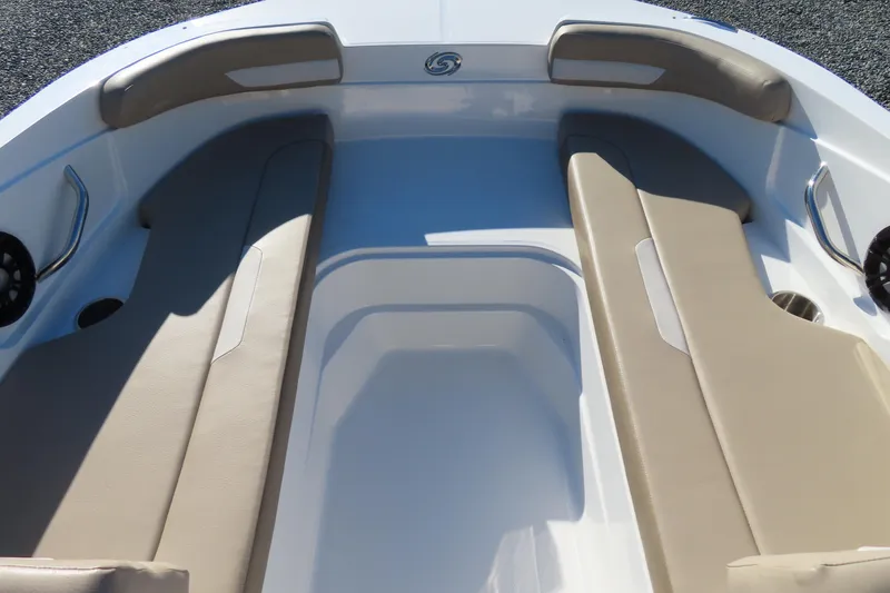 Slide: The Image of 2021 Hurricane SunDeck Sport 185 OB boat interior with beige seating and cup holders. - 7