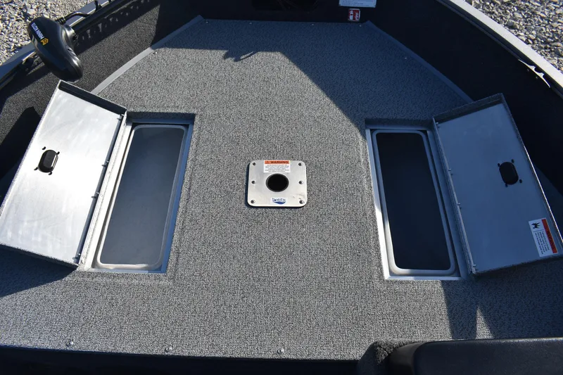 Slide: The Image of 2026 Lowe Fishing Machine 1675SC boat deck with storage compartments open. - 14