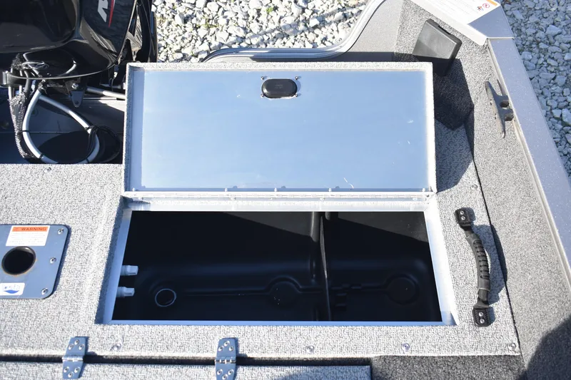 Slide: The Image of Open storage compartment on 2026 Lowe Fishing Machine 1675SC boat. - 15