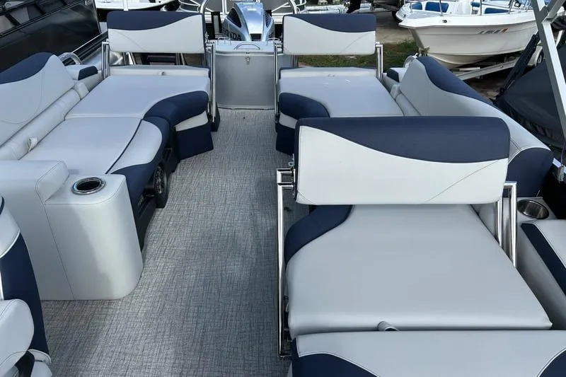 Slide: The Image of 2025 Avalon LSZ Quad Lounger Shift pontoon boat interior with luxurious seating. - 1