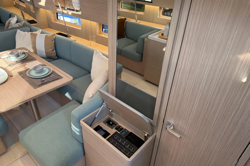 Slide: The Image of Luxurious interior of 2026 Beneteau Oceanis 47 yacht with elegant dining area. - 10
