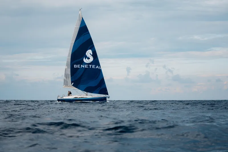 Slide: The Image of 2026 Beneteau Oceanis 47 sailing on open sea under cloudy sky. - 2