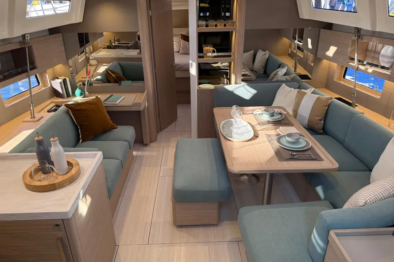 Slide: The Image of Luxurious interior of 2026 Beneteau Oceanis 47 yacht with elegant dining area and modern decor. - 6