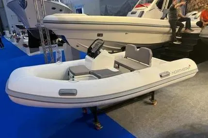 Slide: The Image of 2026 Northstar Vega 3.5 boat with Tohatsu 30HP engine on display at a boat show. - 6