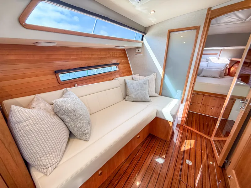 Slide: The Image of Luxurious interior of 2026 MJM 47R yacht with elegant wood finish and plush seating. - 12