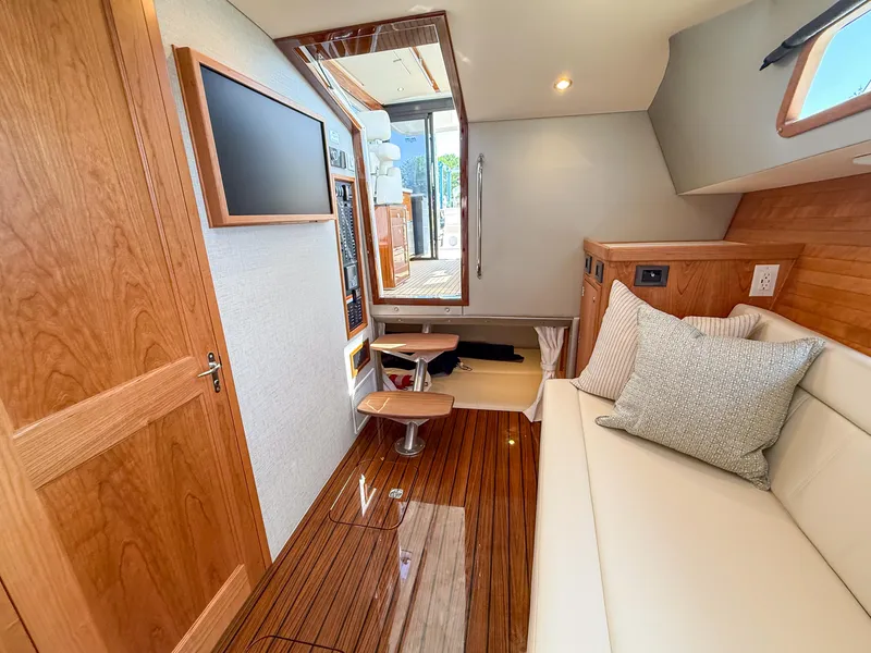 Slide: The Image of Interior of 2026 MJM 47R yacht with wooden flooring and modern furnishings. - 18