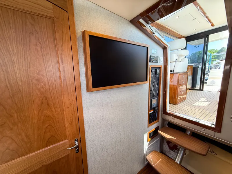 Slide: The Image of Interior of 2026 MJM 47R yacht with wooden finishes and modern control panel. - 19