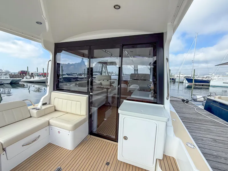 Slide: The Image of 2026 MJM 47R yacht interior with seating, docked at marina. - 23