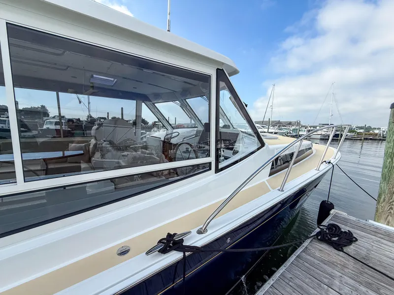 Slide: The Image of 2026 MJM 47R yacht docked at marina, showcasing sleek design and spacious interior. - 25