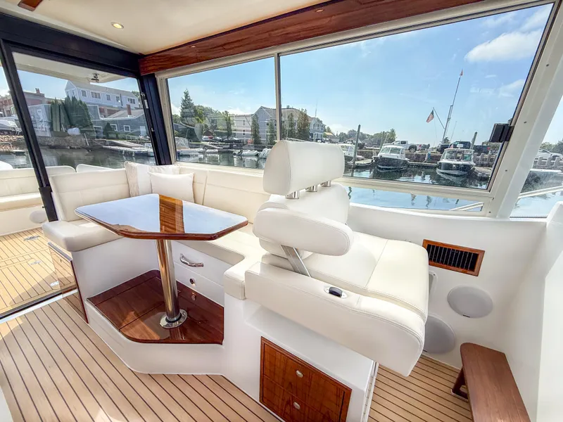 Slide: The Image of Luxurious interior of 2026 MJM 47R yacht with elegant seating and waterfront view. - 3