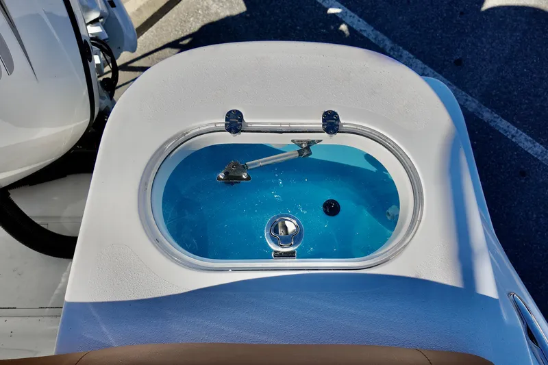 Slide: The Image of Livewell on 2026 NauticStar 212 Legacy boat, filled with blue water. - 10