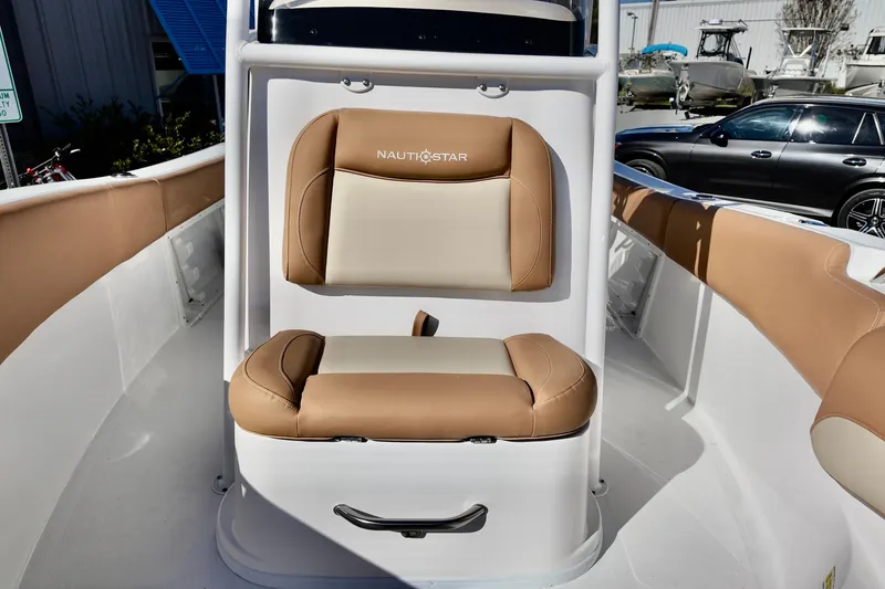 Slide: The Image of 2026 NauticStar 212 Legacy boat interior with tan and cream seating. - 20