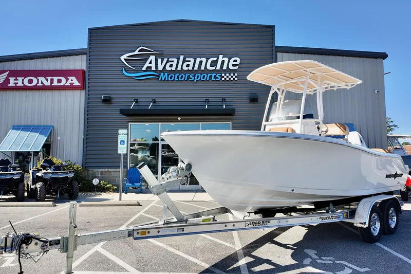 The Image of 2026 NauticStar 212 Legacy boat on trailer at Avalanche Motorsports dealership. - 4