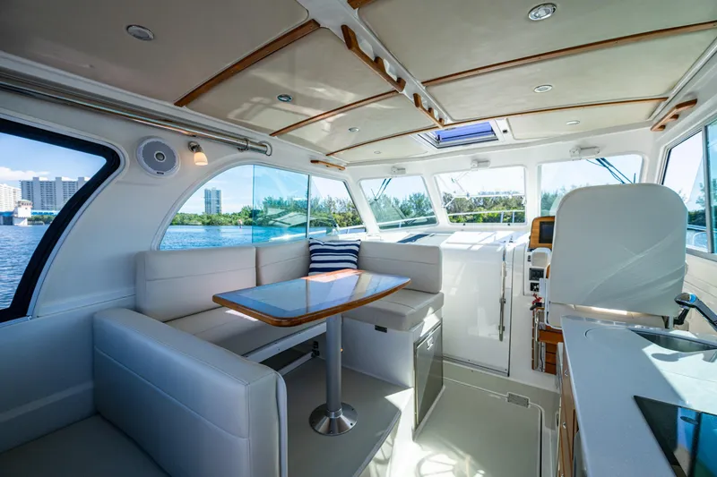 Slide: The Image of Interior of 2020 Back Cove 340 boat with modern seating and panoramic windows. - 16